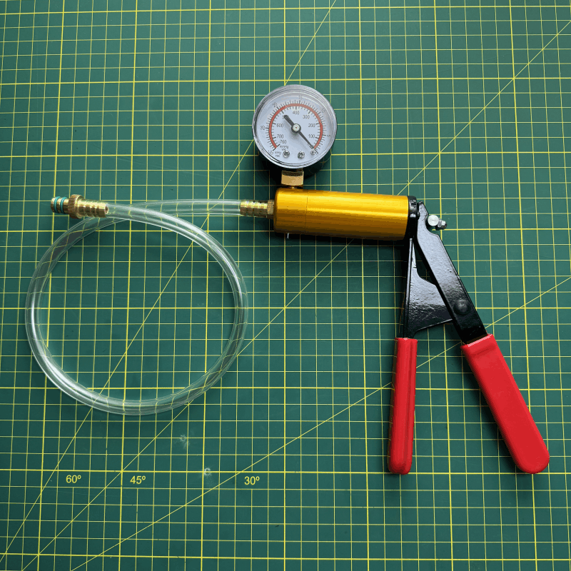 Bomba de vacío manual.